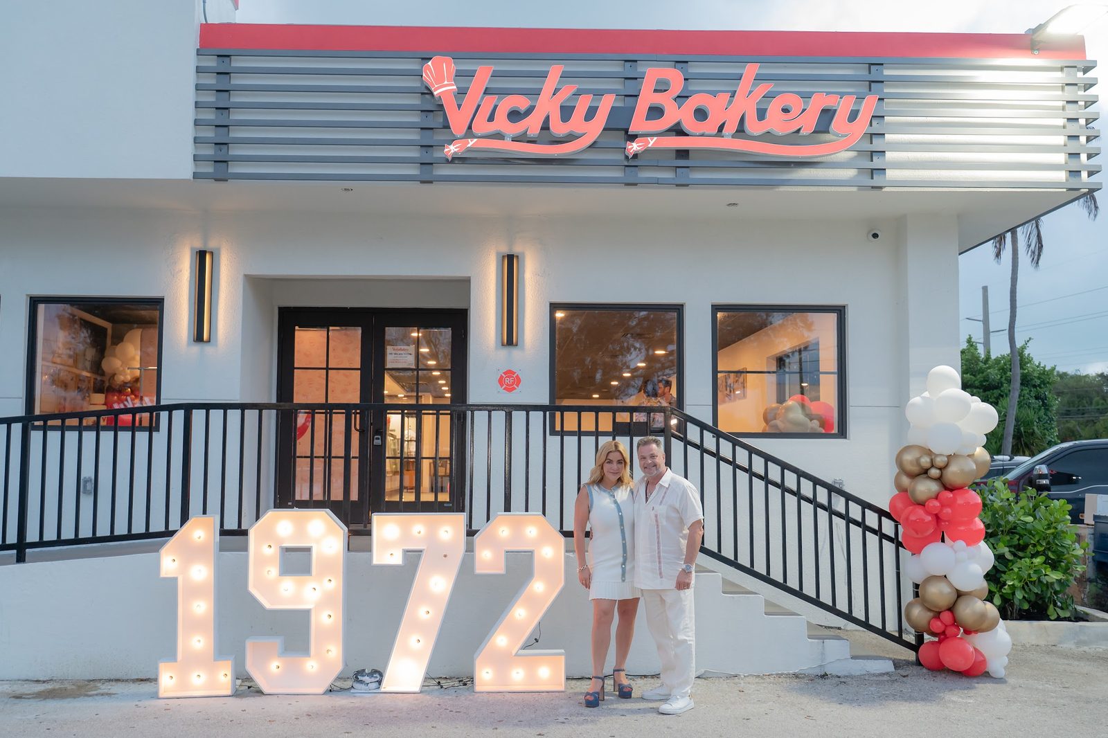 The Vicky Bakery storefront in Key Largo with large lit letters reading 1972 on the steps